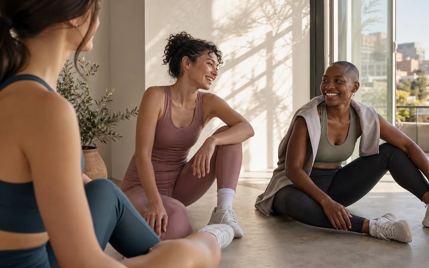 Women in Veyora Fit style activewear resting together after movement